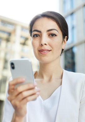 young-businesswoman-holding-smartphone.jpg